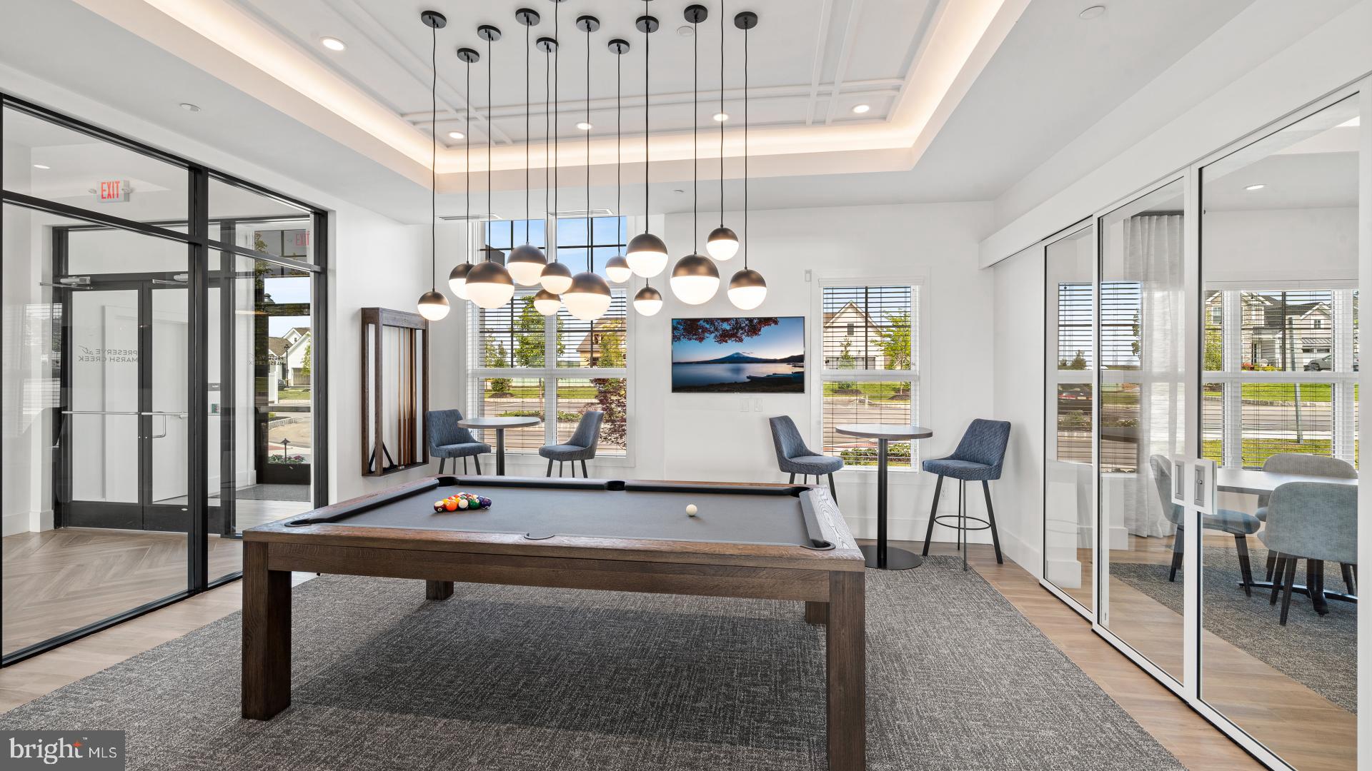 526 Trifecta Road, Unit 284 Downingtown, PA 19335 - Photo 13 of 24 a living room with furniture a chandelier and a table