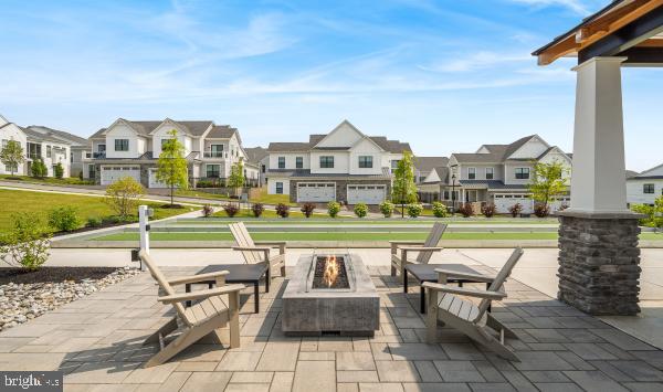 526 Trifecta Road, Unit 284 Downingtown, PA 19335 - Photo 20 of 24 a view of swimming pool with outdoor seating and a yard