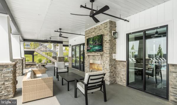 526 Trifecta Road, Unit 284 Downingtown, PA 19335 - Photo 22 of 24 a living room with patio furniture and a large window