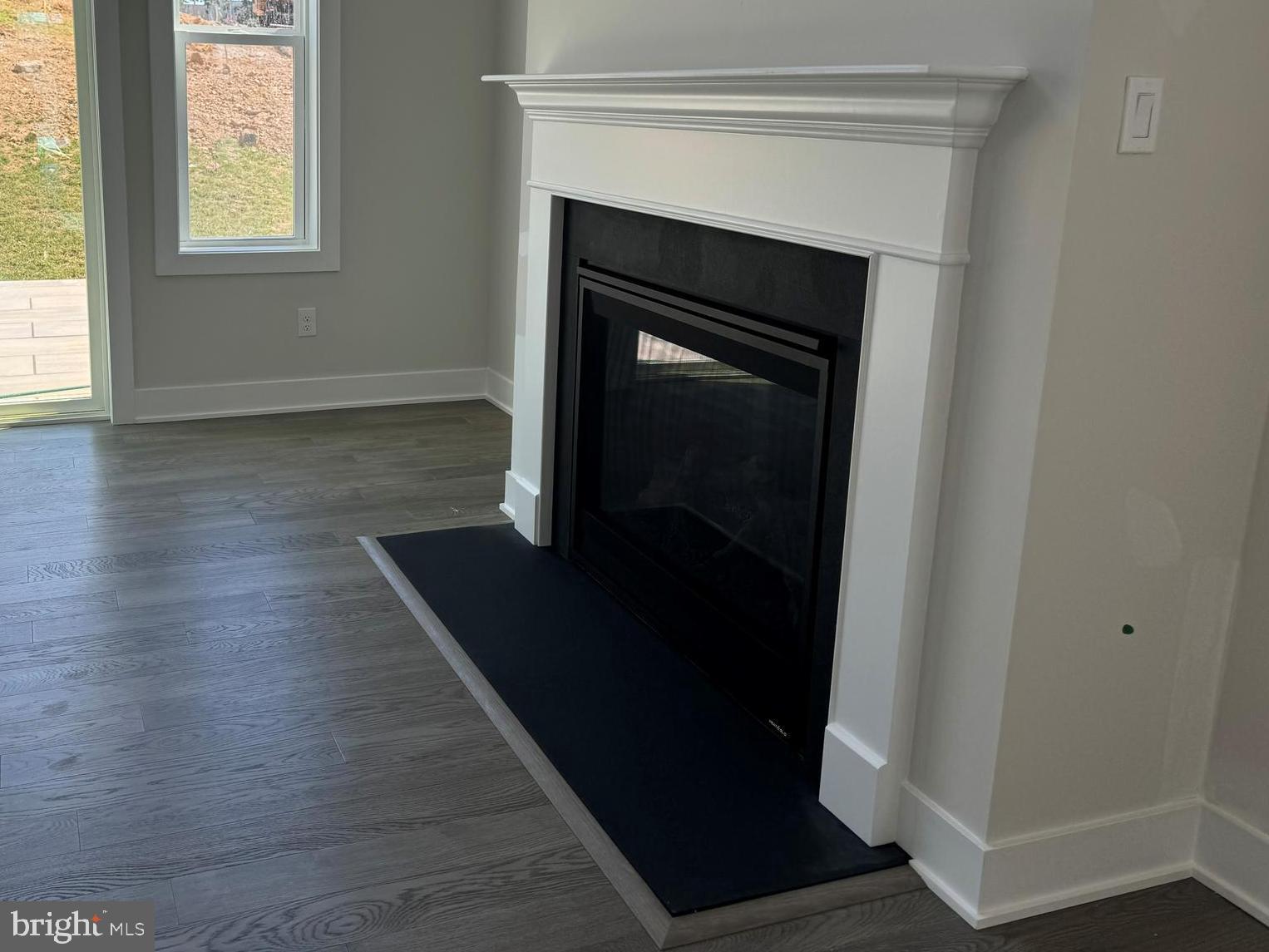 526 Trifecta Road, Unit 284 Downingtown, PA 19335 - Photo 4 of 24 a living room with wooden floor and a fireplace