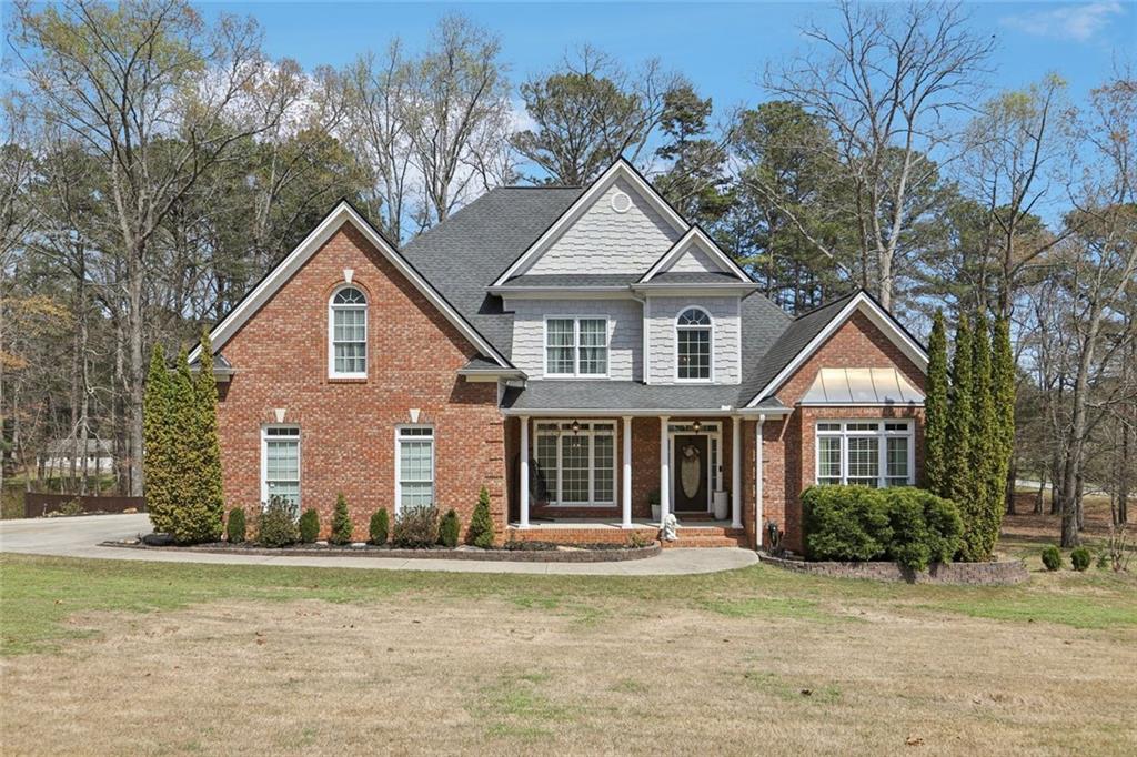 640 Ivy Lea Drive Southeast Lawrenceville, GA 30045 - Photo 1 of 79 a front view of a house with a yard