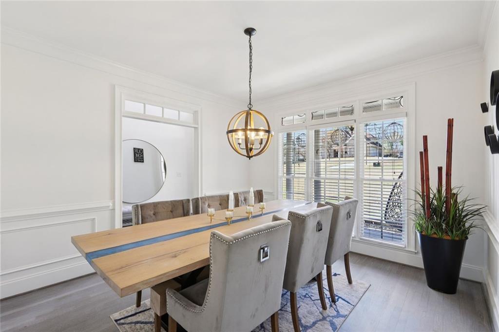 640 Ivy Lea Drive Southeast Lawrenceville, GA 30045 - Photo 14 of 79 a dining room with furniture window and wooden floor