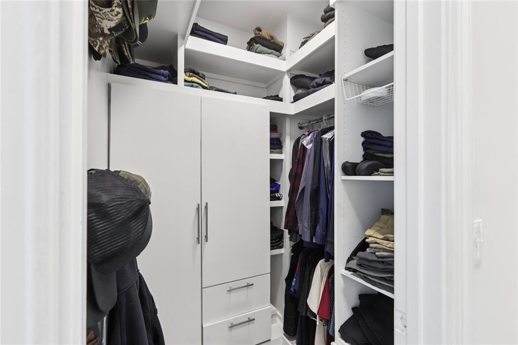 640 Ivy Lea Drive Southeast Lawrenceville, GA 30045 - Photo 26 of 79 a view of walk in closet with clothes and shoes