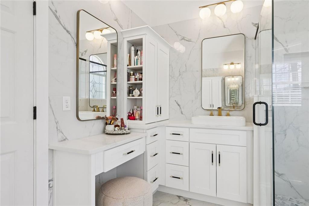 640 Ivy Lea Drive Southeast Lawrenceville, GA 30045 - Photo 28 of 79 a bathroom with a double vanity sink mirror and shower