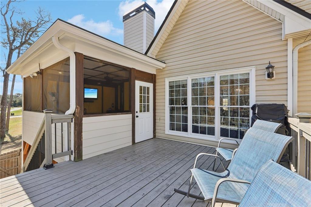 640 Ivy Lea Drive Southeast Lawrenceville, GA 30045 - Photo 55 of 79 a view of a deck with wooden floor and outdoor seating