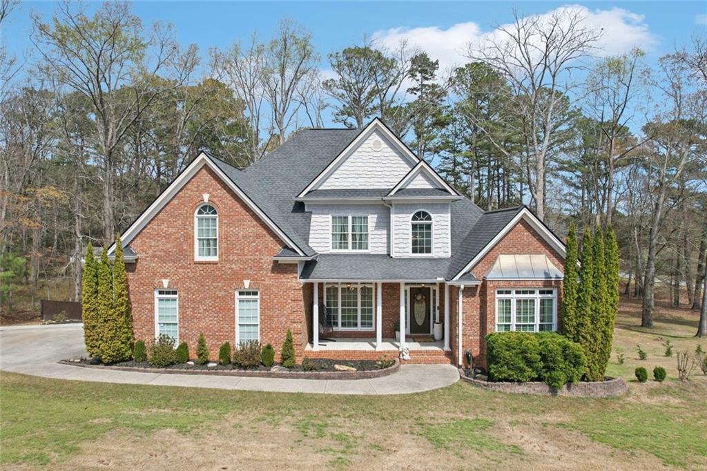 640 Ivy Lea Drive Southeast Lawrenceville, GA 30045 - Photo 61 of 79 a front view of a house with a yard and garage