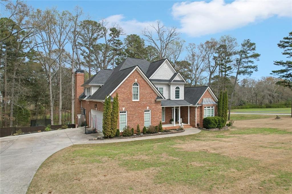 640 Ivy Lea Drive Southeast Lawrenceville, GA 30045 - Photo 69 of 79 a front view of a house with a yard