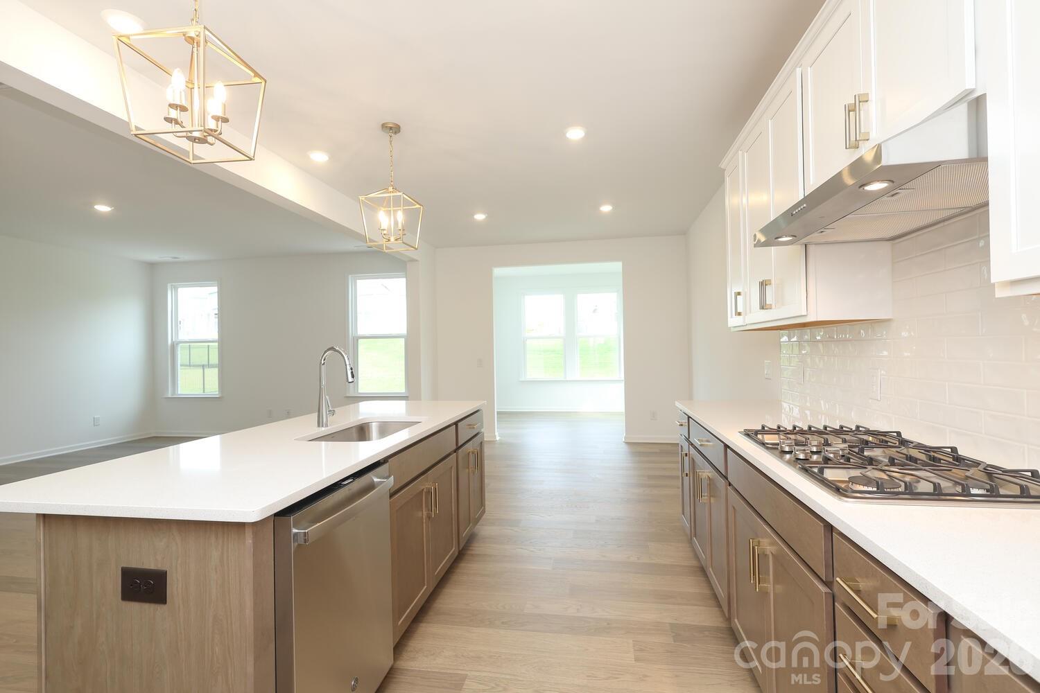 1190 Sugar Crk Road Fort Mill, SC 29707 - Photo 15 of 47 a large kitchen with kitchen island a sink stainless steel appliances and cabinets