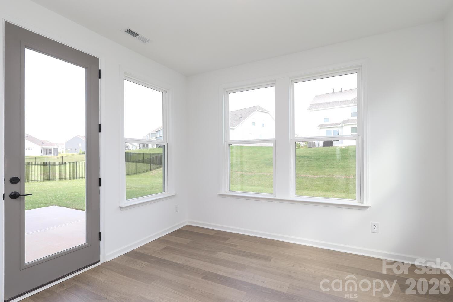 1190 Sugar Crk Road Fort Mill, SC 29707 - Photo 17 of 47 a view of an empty room with wooden floor and a window