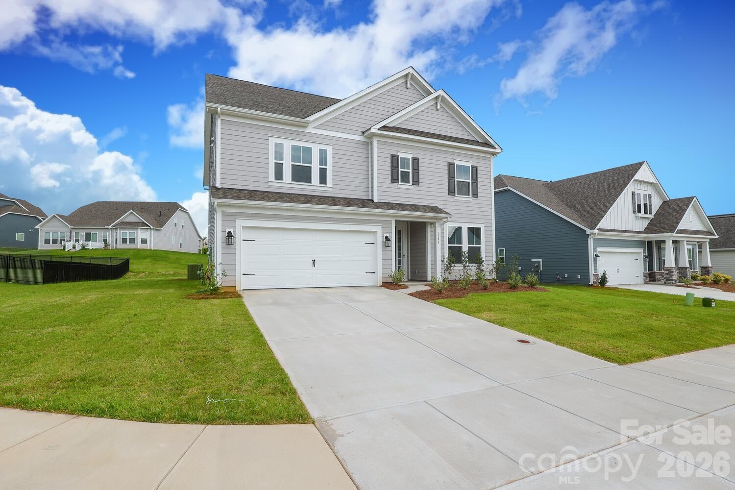 1190 Sugar Crk Road Fort Mill, SC 29707 - Photo 2 of 47 a front view of a house with a yard and garage