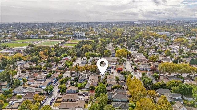 an aerial view of residential houses with outdoor space