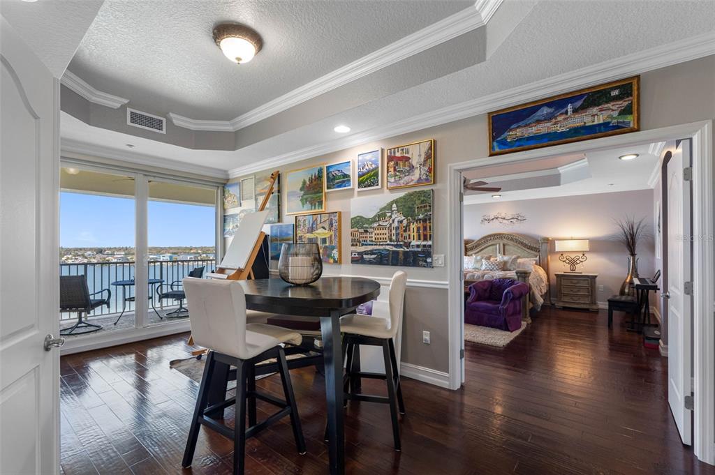 17717 Gulf Boulevard, Unit 702 Redington Shores, FL 33708 - Photo 20 of 99 a dining room with furniture and wooden floor