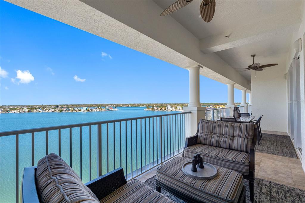 17717 Gulf Boulevard, Unit 702 Redington Shores, FL 33708 - Photo 30 of 99 a balcony with furniture