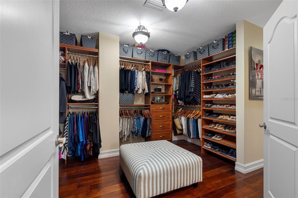 17717 Gulf Boulevard, Unit 702 Redington Shores, FL 33708 - Photo 34 of 99 a view of walk in closet with clothes and shoes