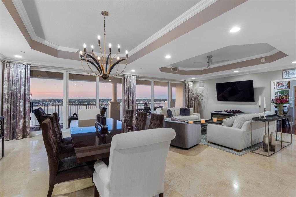 17717 Gulf Boulevard, Unit 702 Redington Shores, FL 33708 - Photo 4 of 99 a living room with lots of furniture and large windows