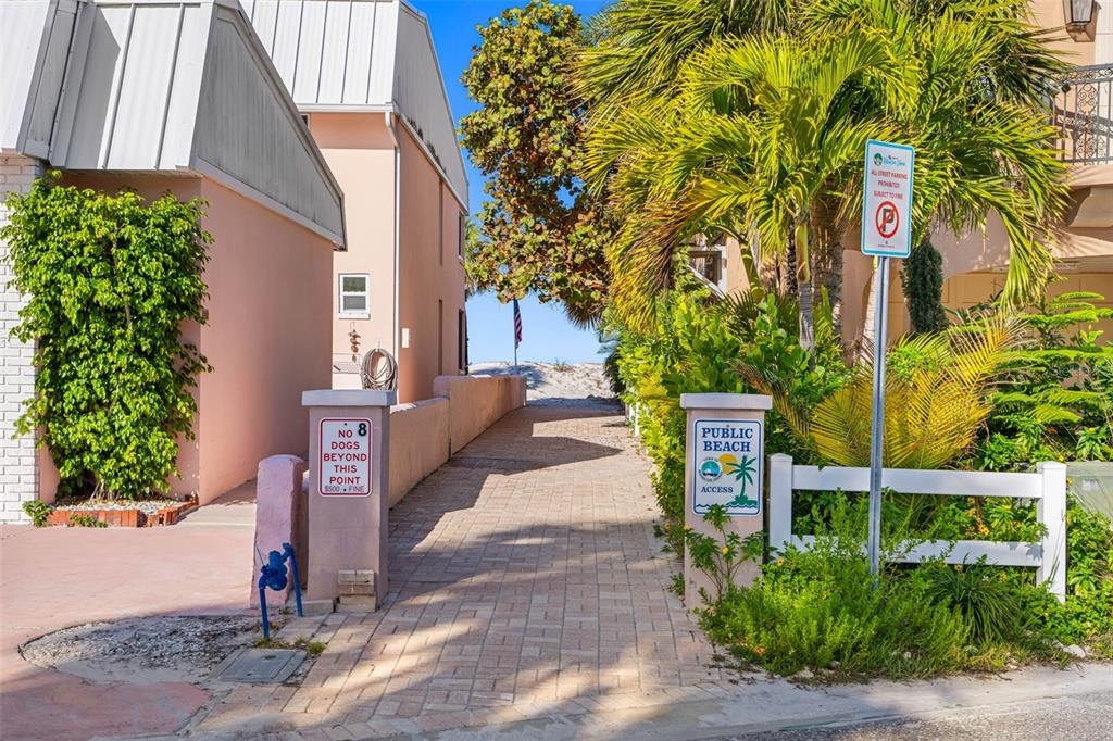 17717 Gulf Boulevard, Unit 702 Redington Shores, FL 33708 - Photo 50 of 99 a front view of a house with a yard
