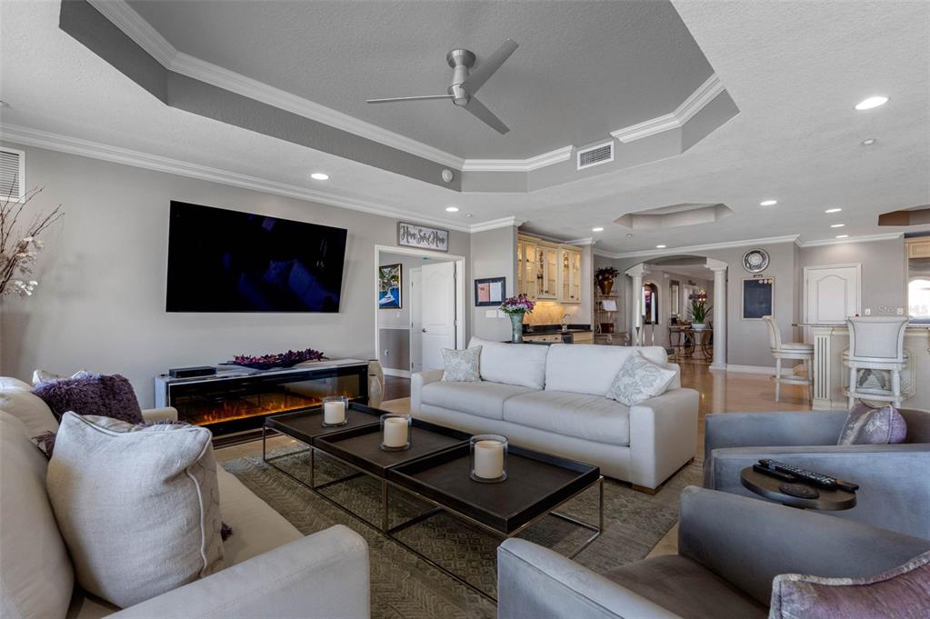 17717 Gulf Boulevard, Unit 702 Redington Shores, FL 33708 - Photo 56 of 99 a living room with furniture and a flat screen tv