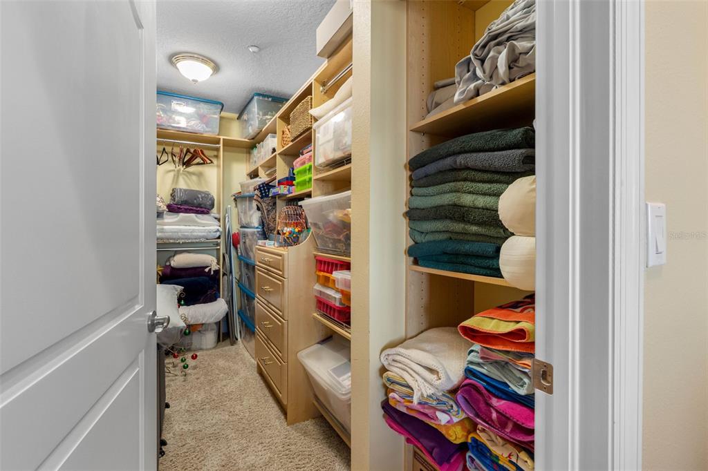 17717 Gulf Boulevard, Unit 702 Redington Shores, FL 33708 - Photo 71 of 99 a view of walk in closet with clothes and shoes
