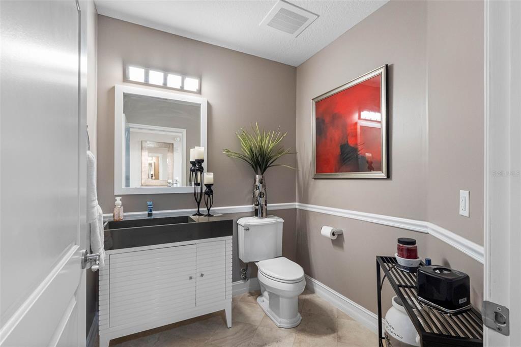 17717 Gulf Boulevard, Unit 702 Redington Shores, FL 33708 - Photo 79 of 99 a bathroom with a toilet sink and mirror