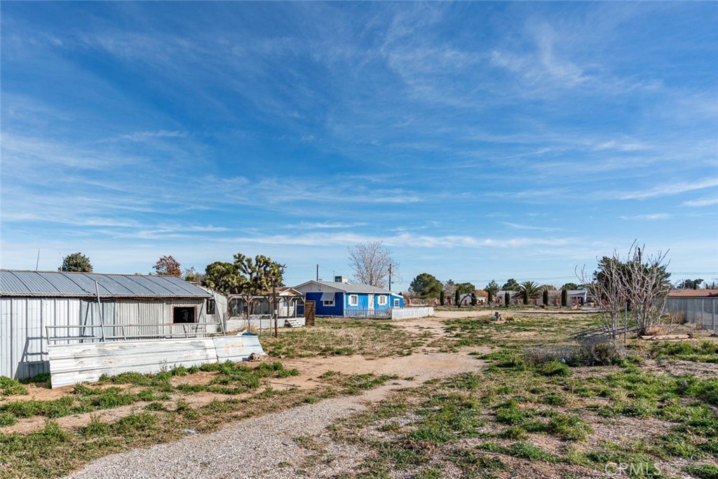 43254 52nd Street West Lancaster, CA 93536 - Photo 13 of 18 a view of a house with a yard