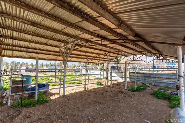 a view of a house with a yard covered with snow in the background