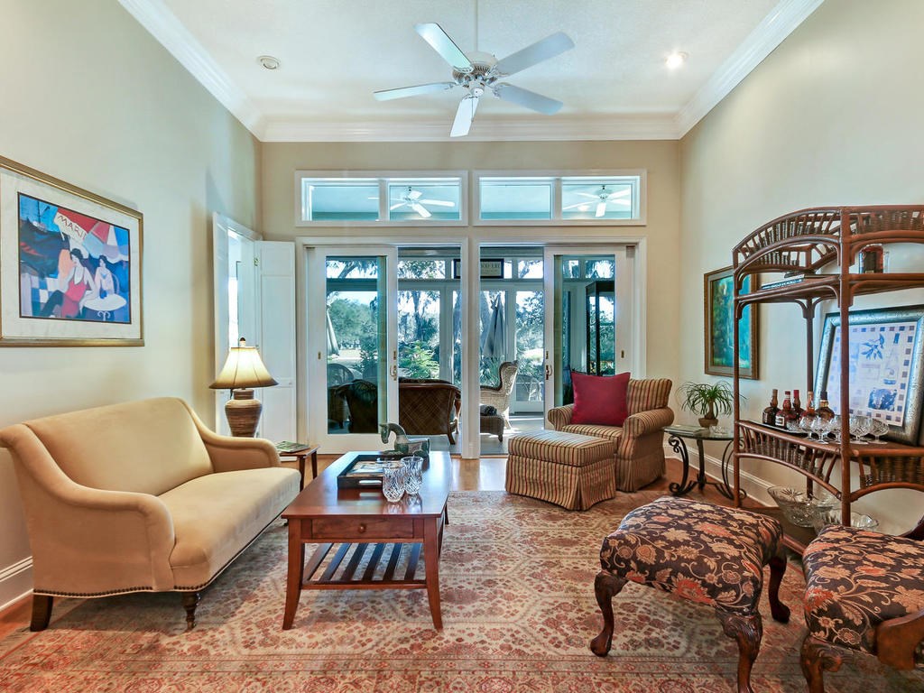 35 Sea Marsh Road Amelia Island, FL 32034 - Photo 4 of 34 a living room with furniture ceiling fan and a large window