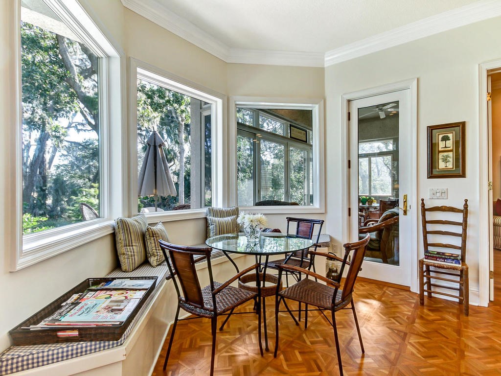 35 Sea Marsh Road Amelia Island, FL 32034 - Photo 7 of 34 a view of a dining room with furniture and windows