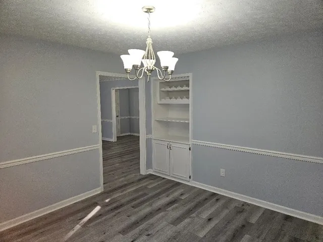 a view of a chandelier in an empty room