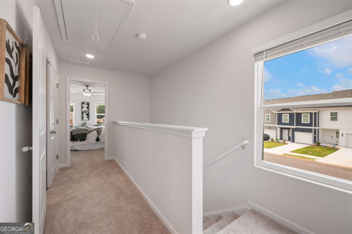 9435 Maple Grove Lane Jonesboro, GA 30238 - Photo 21 of 35 a view of a hallway with bathroom and a bathtub