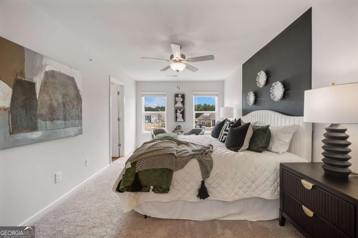9435 Maple Grove Lane Jonesboro, GA 30238 - Photo 26 of 35 a bedroom with a bed and wooden floor