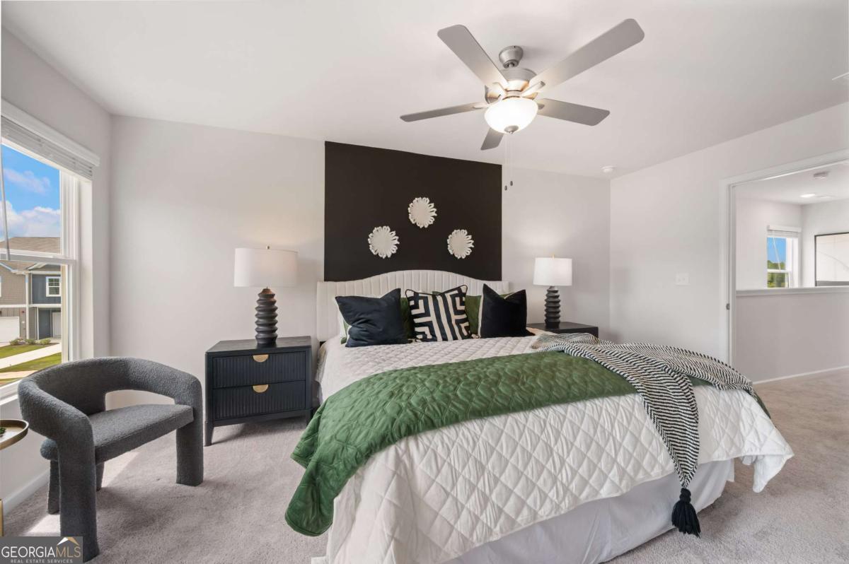 9435 Maple Grove Lane Jonesboro, GA 30238 - Photo 28 of 35 a bedroom with a bed and window