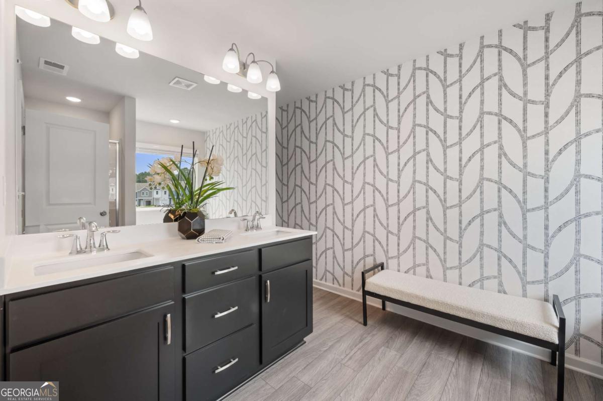 9435 Maple Grove Lane Jonesboro, GA 30238 - Photo 29 of 35 a bathroom with a sink vanity granite and a mirror