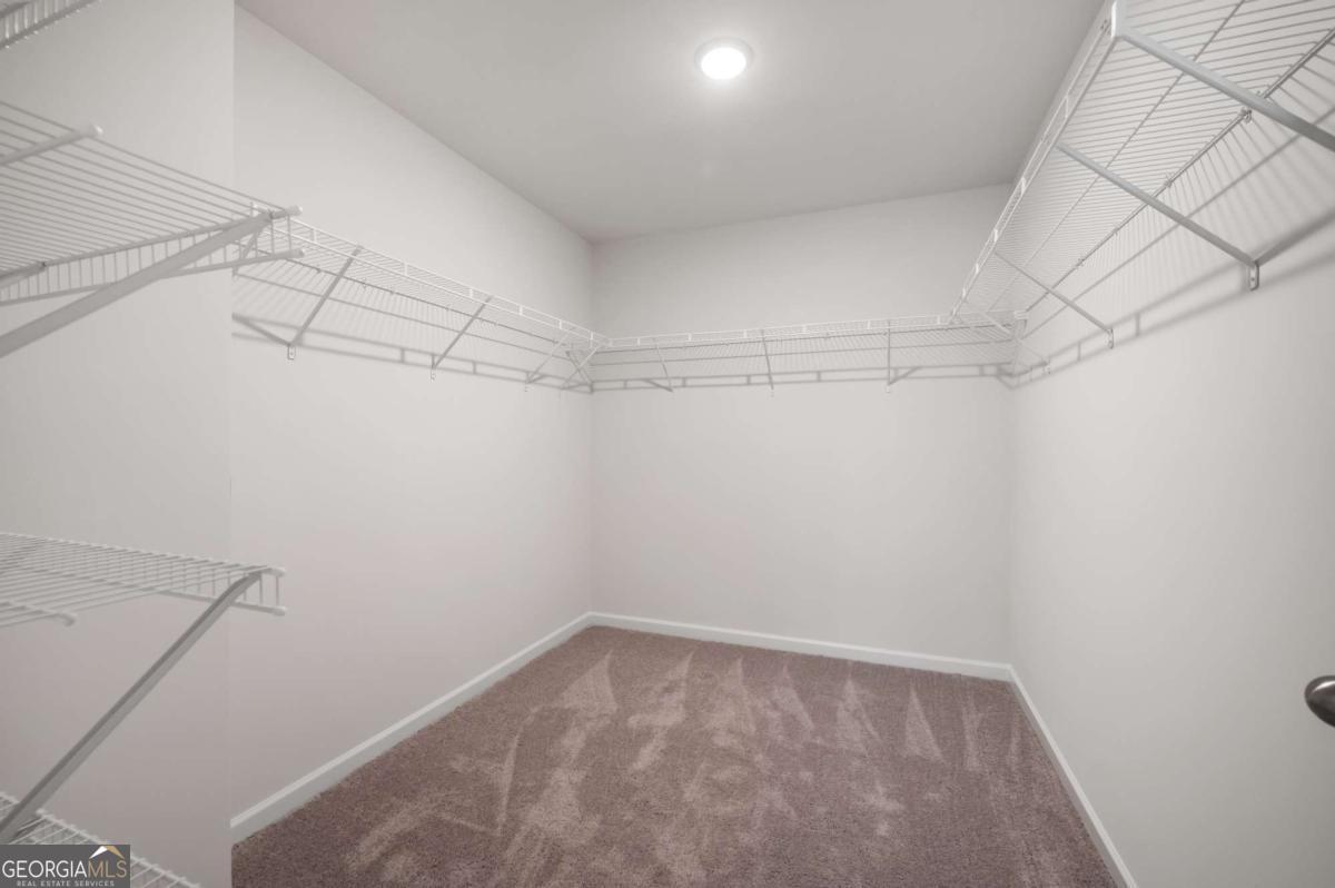 9435 Maple Grove Lane Jonesboro, GA 30238 - Photo 32 of 35 a view of a room with racks on the wall