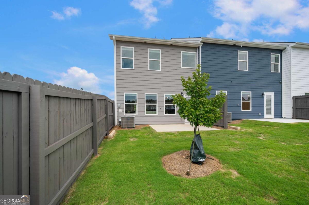 9435 Maple Grove Lane Jonesboro, GA 30238 - Photo 34 of 35 a front view of a house with a yard