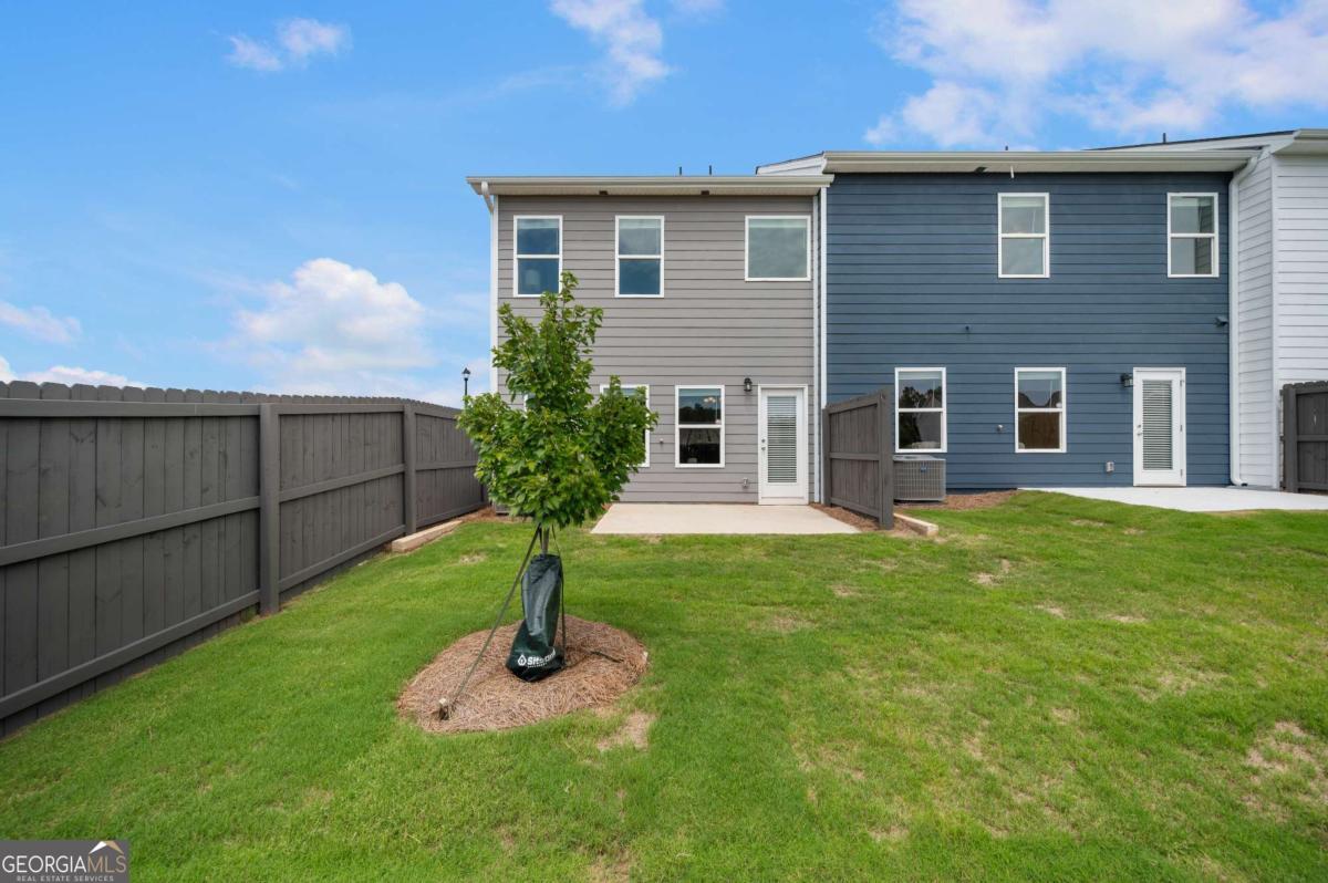 9435 Maple Grove Lane Jonesboro, GA 30238 - Photo 35 of 35 a front view of a house with garden