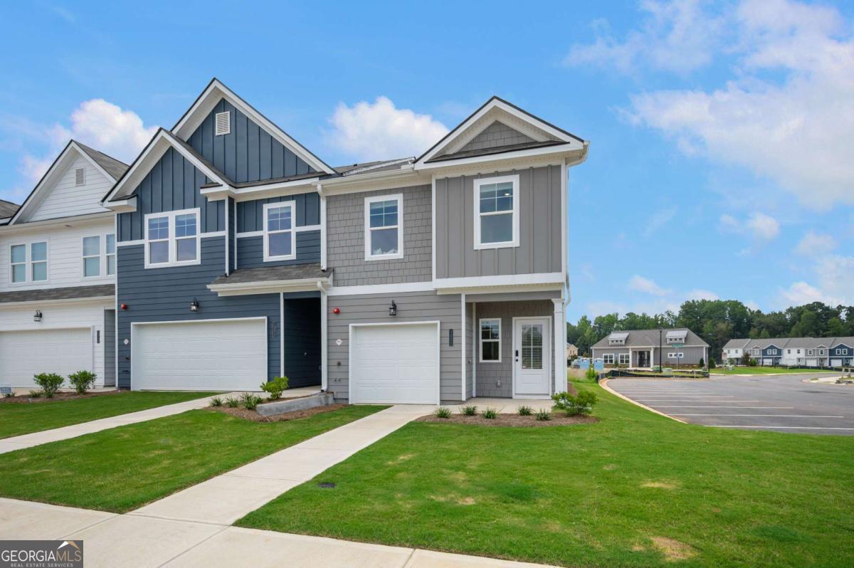 9435 Maple Grove Lane Jonesboro, GA 30238 - Photo 4 of 35 a front view of a house with a yard