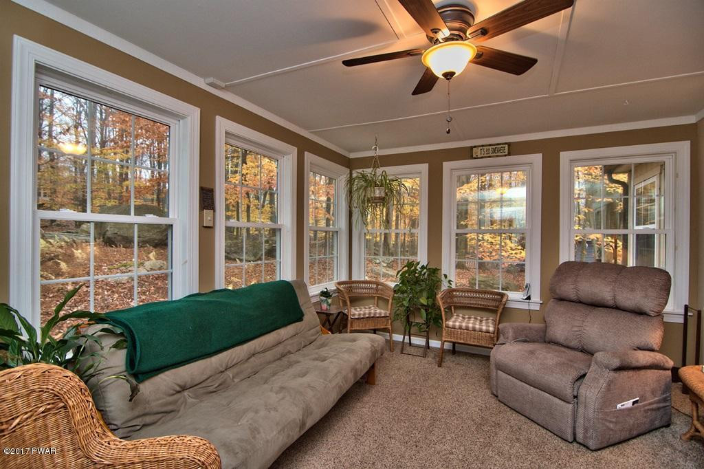 3296 Northgate Road Lake Ariel, PA 18436 - Photo 27 of 33 a living room with furniture and a large window