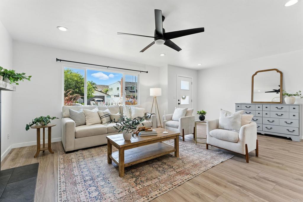 a living room with furniture and a large window