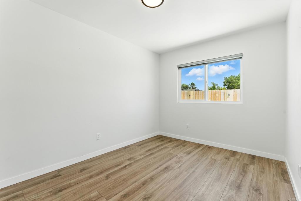 10021 Allenwood Way Santee, CA 92071 - Photo 15 of 28 a view of empty room with wooden floor and fan