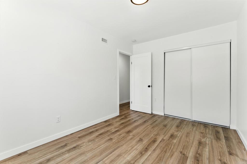 10021 Allenwood Way Santee, CA 92071 - Photo 16 of 28 a view of an empty room with wooden floor