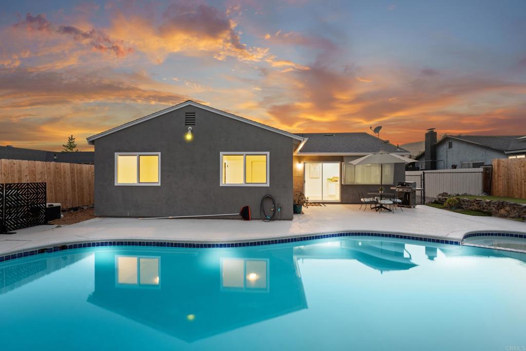 10021 Allenwood Way Santee, CA 92071 - Photo 21 of 28 a front view of a house with swimming pool having outdoor seating