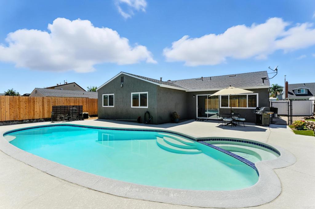 10021 Allenwood Way Santee, CA 92071 - Photo 23 of 28 a view of a house with swimming pool and sitting area