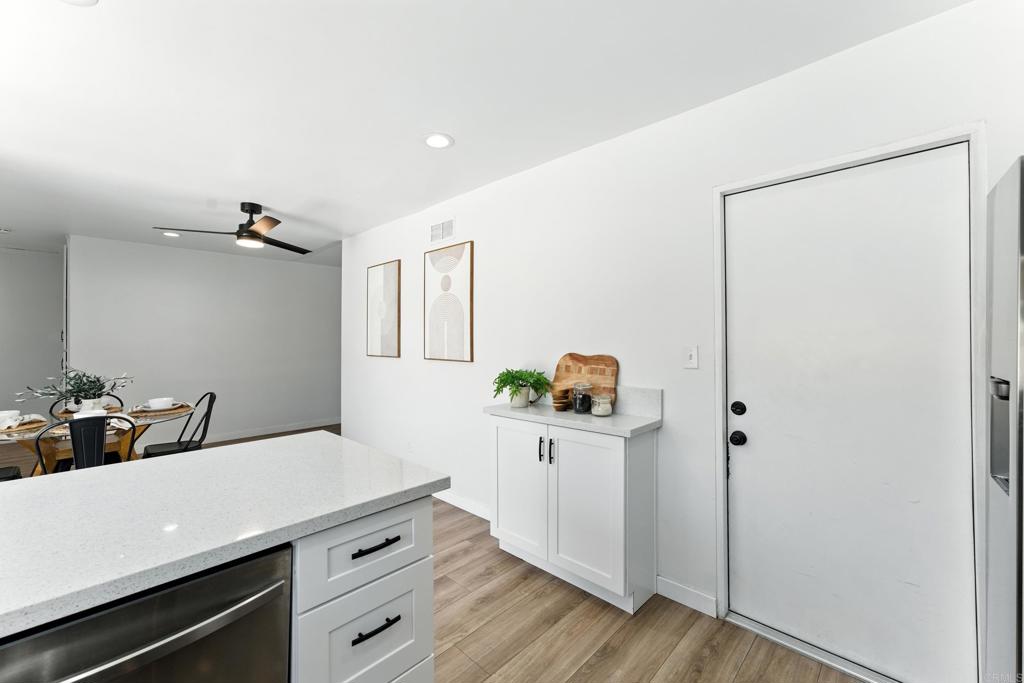 10021 Allenwood Way Santee, CA 92071 - Photo 10 of 28 a kitchen with a sink and wooden floor