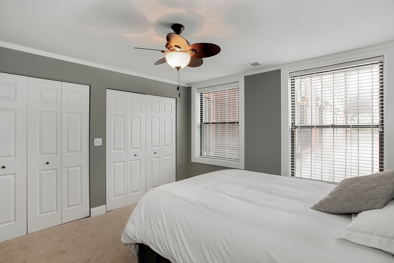 4144 North Sheridan Road, Unit 208 Chicago, IL 60613 - Photo 12 of 24 a bedroom with a large bed and a large window