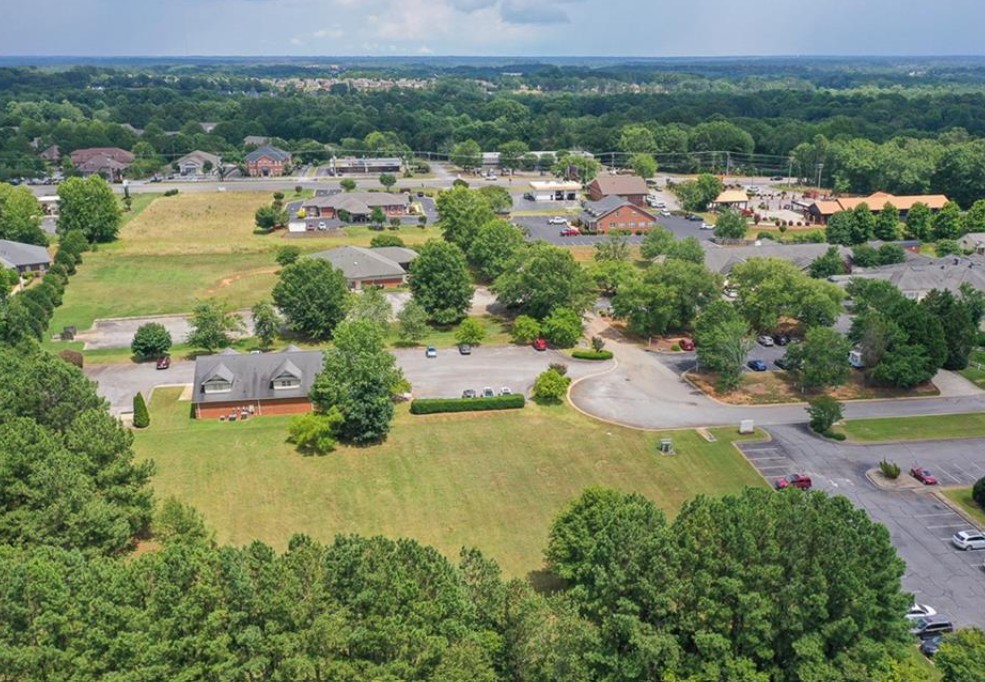 120 Perpetual Square Drive Anderson, SC 29621 - Photo 7 of 14 An aerial panorama showcases vast green expanses amidst a dynamic community, highlighting potential for growth.