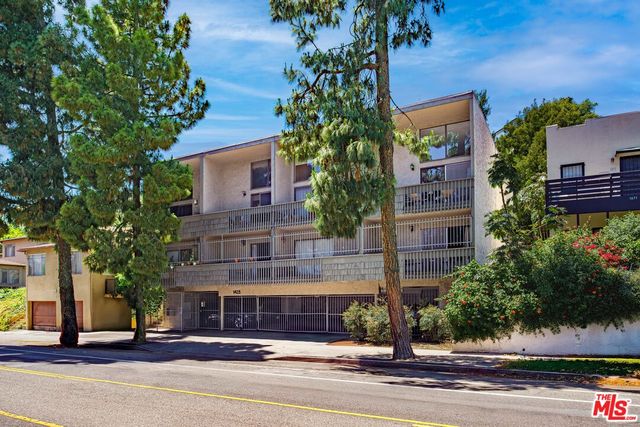 a view of a building and tree s