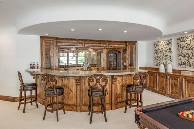 a view of a dining room with furniture and window