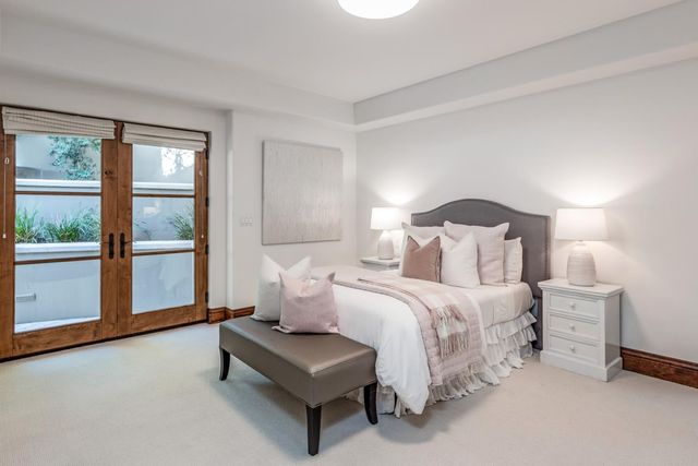 a bathroom with a sink a mirror and a shower