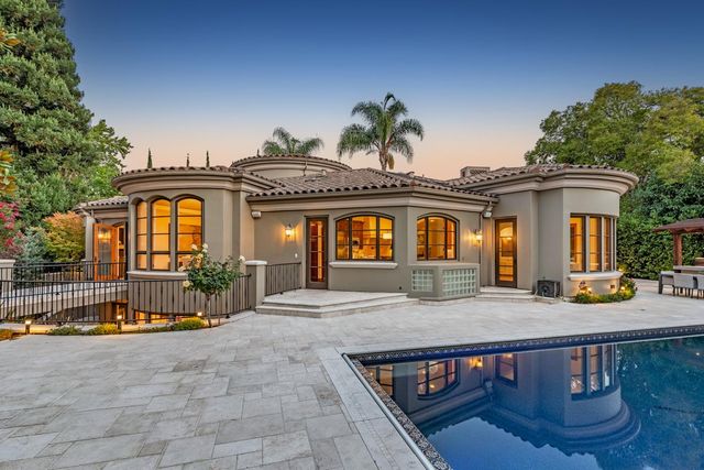a view of swimming pool with outdoor seating