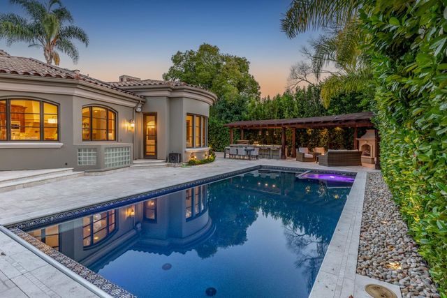 a view of a house with a swimming pool